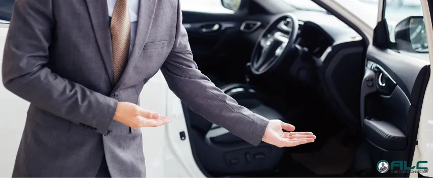 ALC - A chauffeur opening a car door for a passenger