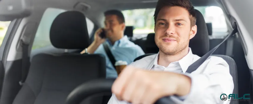 ALC - A private transportation service driver with a business man passenger