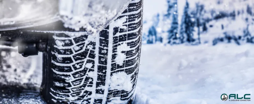 ALC - A snow-covered car tire on a snowy road