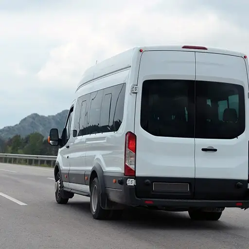 ALS-Tourist-minibus-in-motion-on-background-mountains